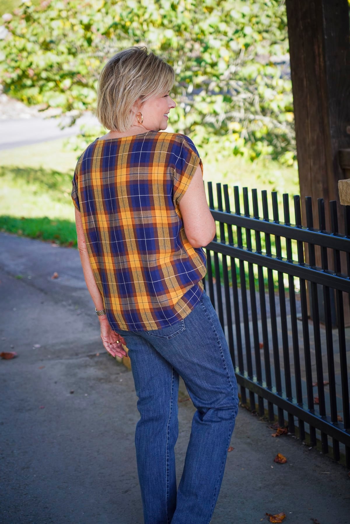 Tania Stephens is showing the back of a blue and yellow check top with jeans during a Coldwater Creek Try On Haul
