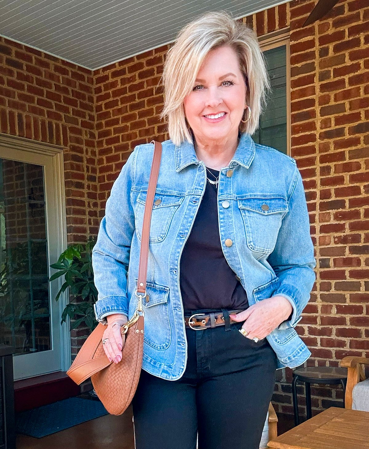 Tania Stephens is wearing a denim jacket a black tee and jeans14