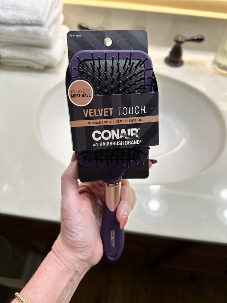 Tania Stephens holding a hair brush