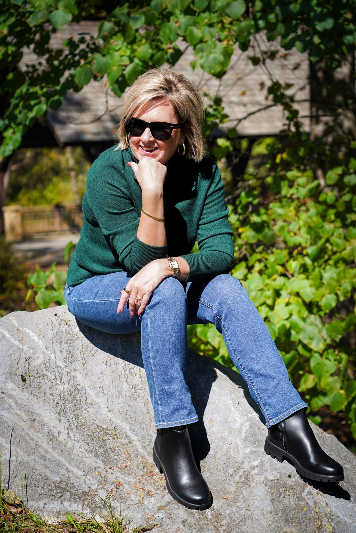 Tania Stephens is wearing a green sweater, jeans, and Lands's End black boots
