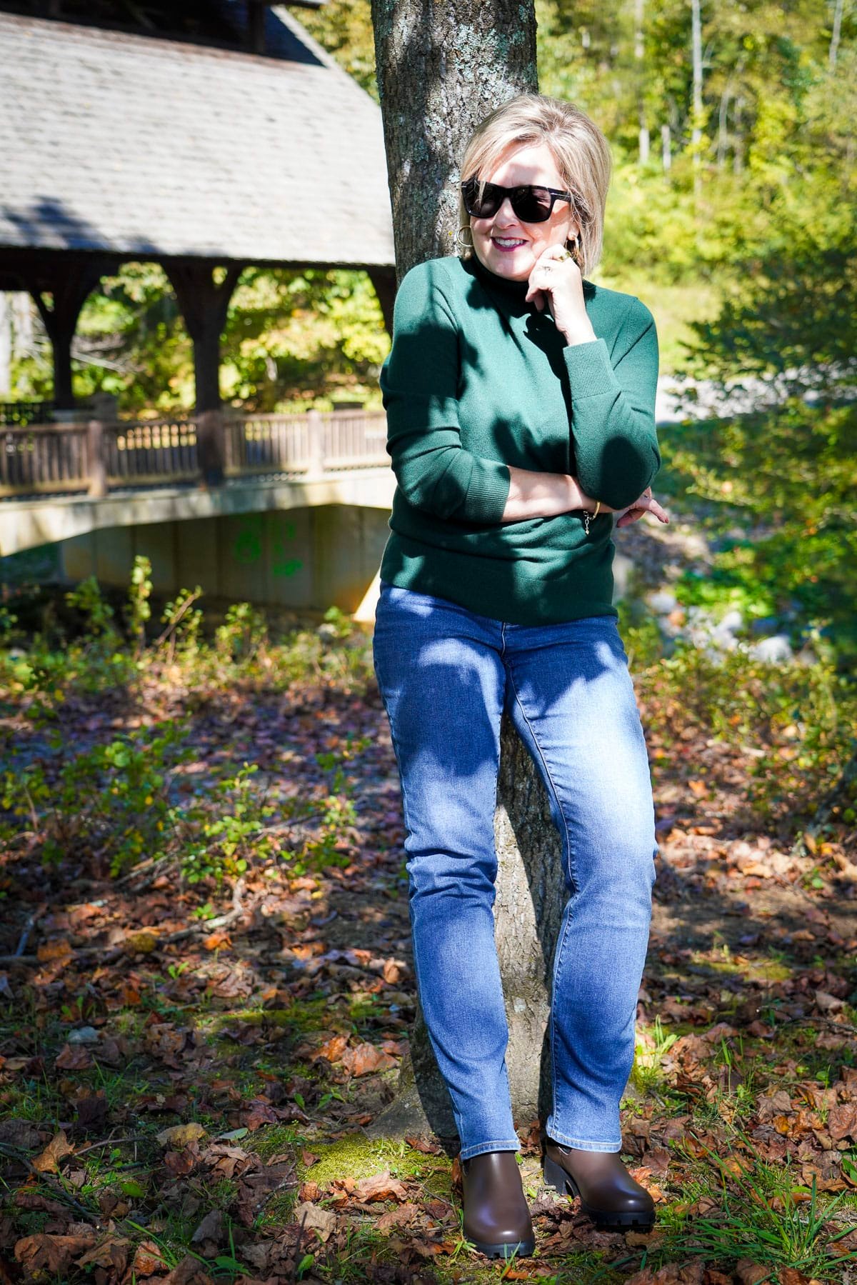 Tania Stephens is wearing a green sweater, jeans, and Lands's End boots in brown
