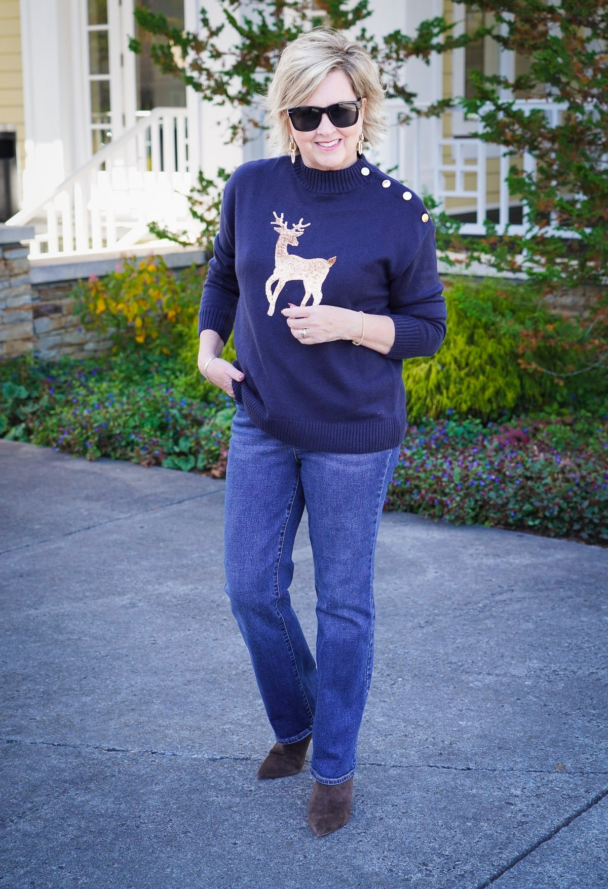 Talbots Holiday Styles You’ll Love - Navy sweater with gold sequin reindeer and bootcut jeans