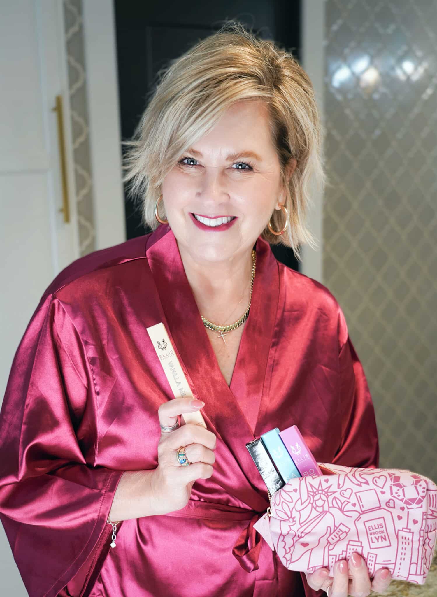 Tania Stephens holding the Rom-Com perfume set by Ellis Brooklyn