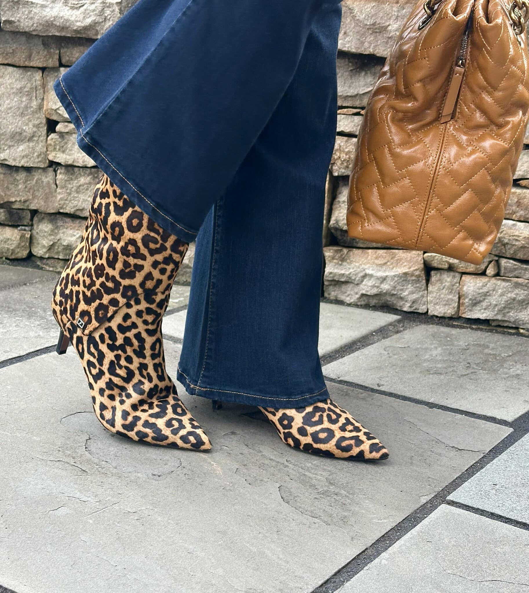 Tania Stephens wearing a pair of jeans and animal print boots