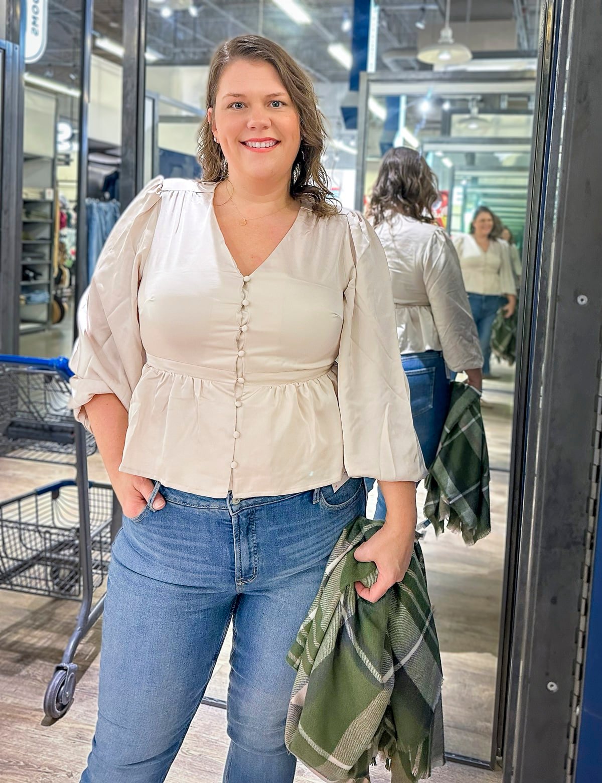 Megan is wearing a peplum shirt