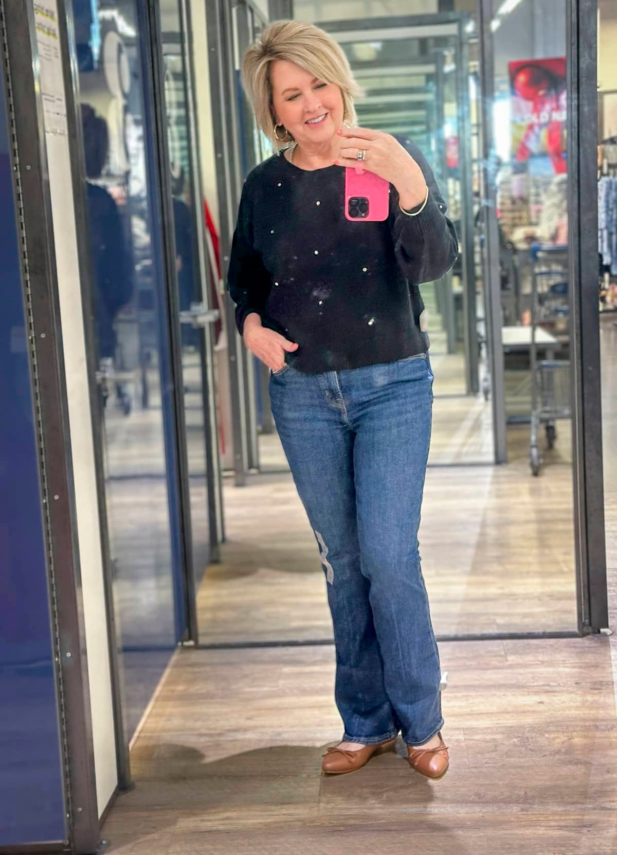 Tania Stephens wearing a black sweater and jeans