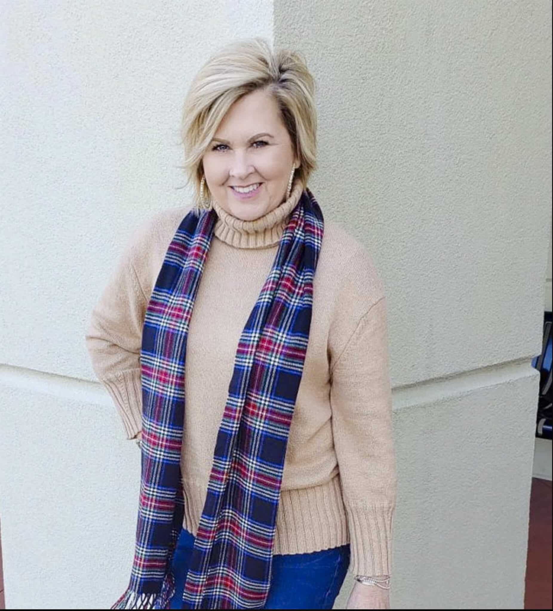 Tania Stephens is wearing a plaid winter scarf