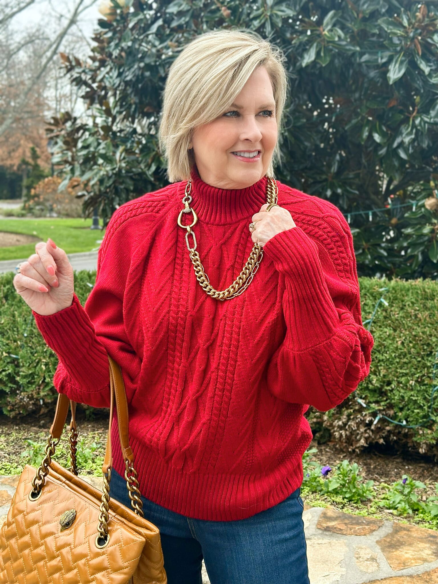 Tania Stephens is wearing a red Amazon turtleneck sweater