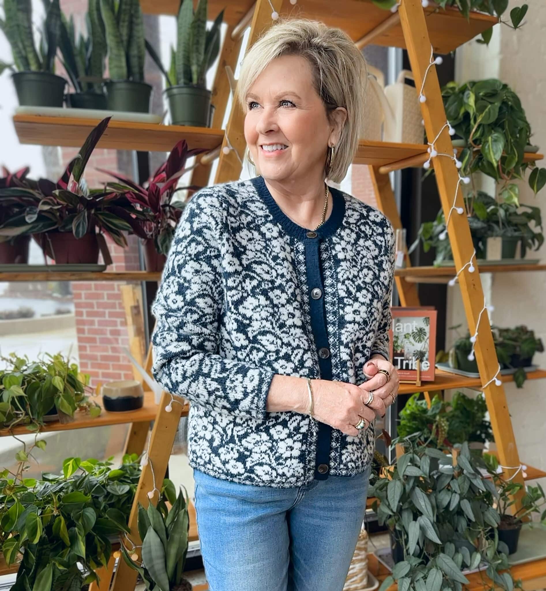 Tania Stephens is wearing a floral navy and white cardigan sweater from Kohl's