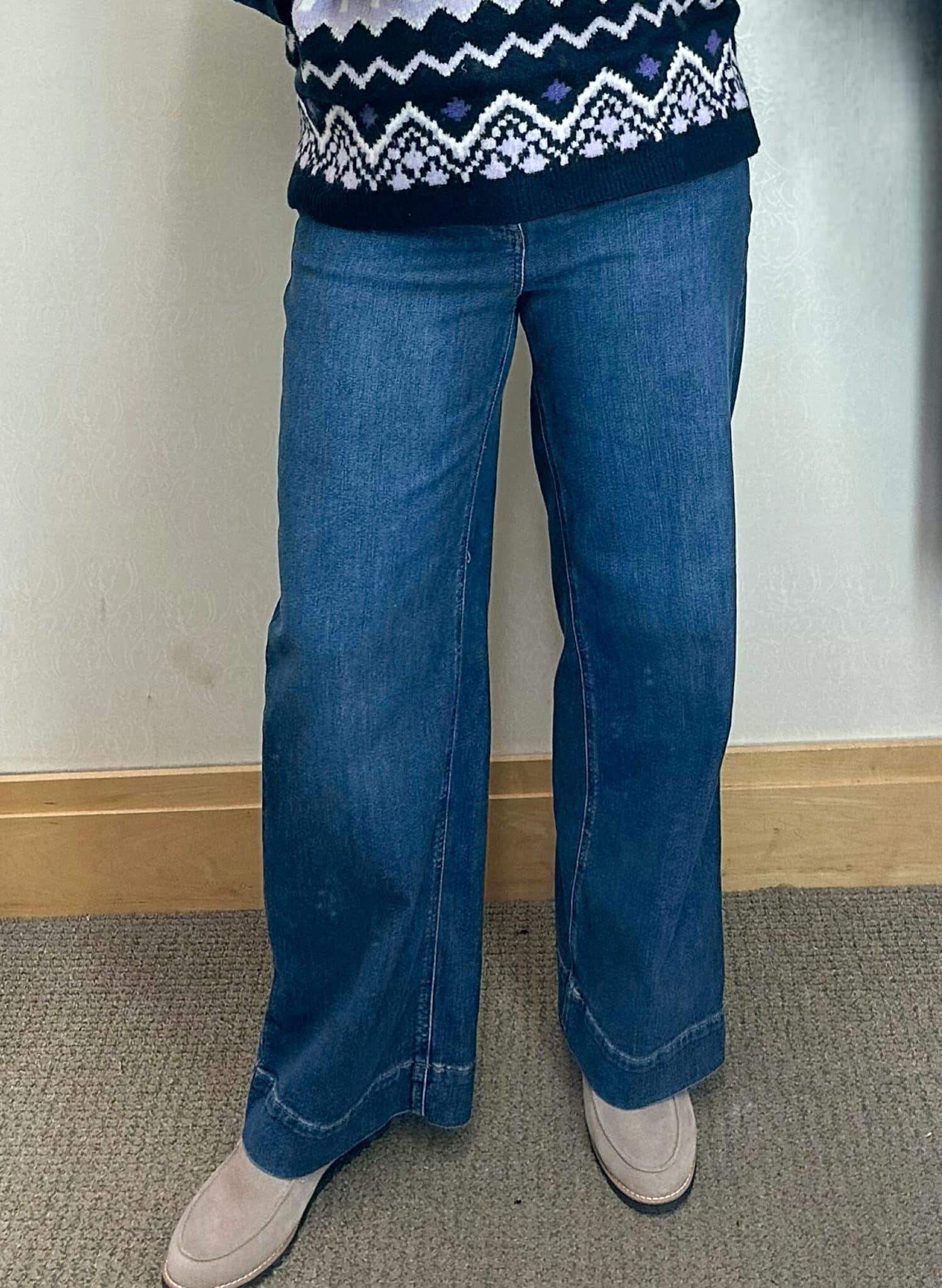 Tania Stephens is wearing wide leg jeans