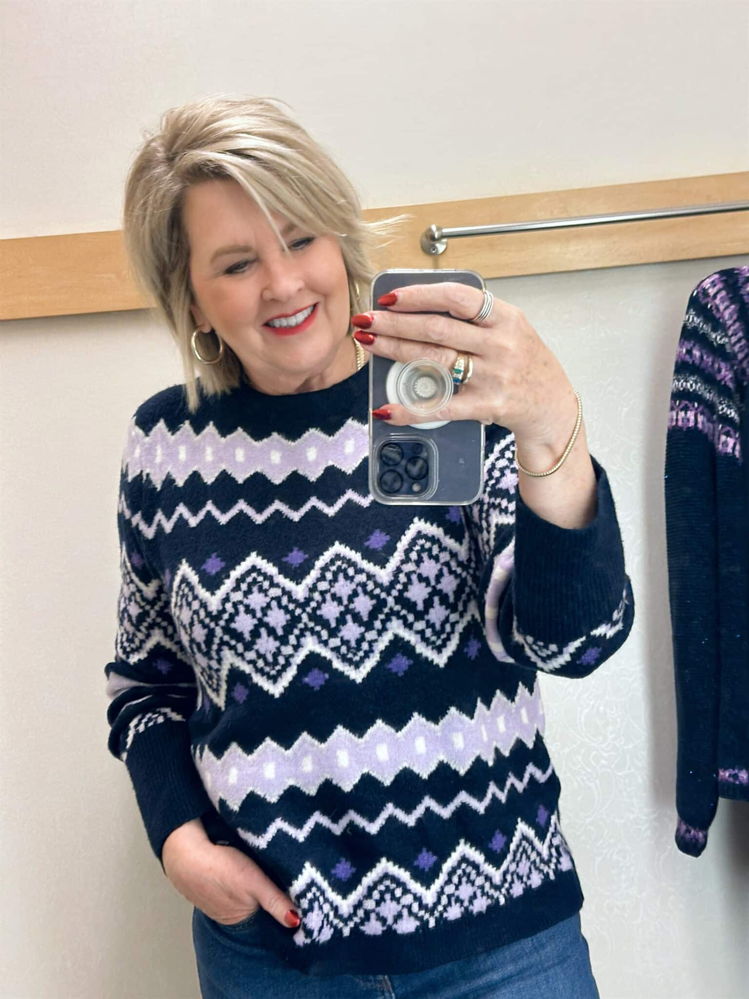 Tania Stephens is wearing a striped Fair Isle sweater 