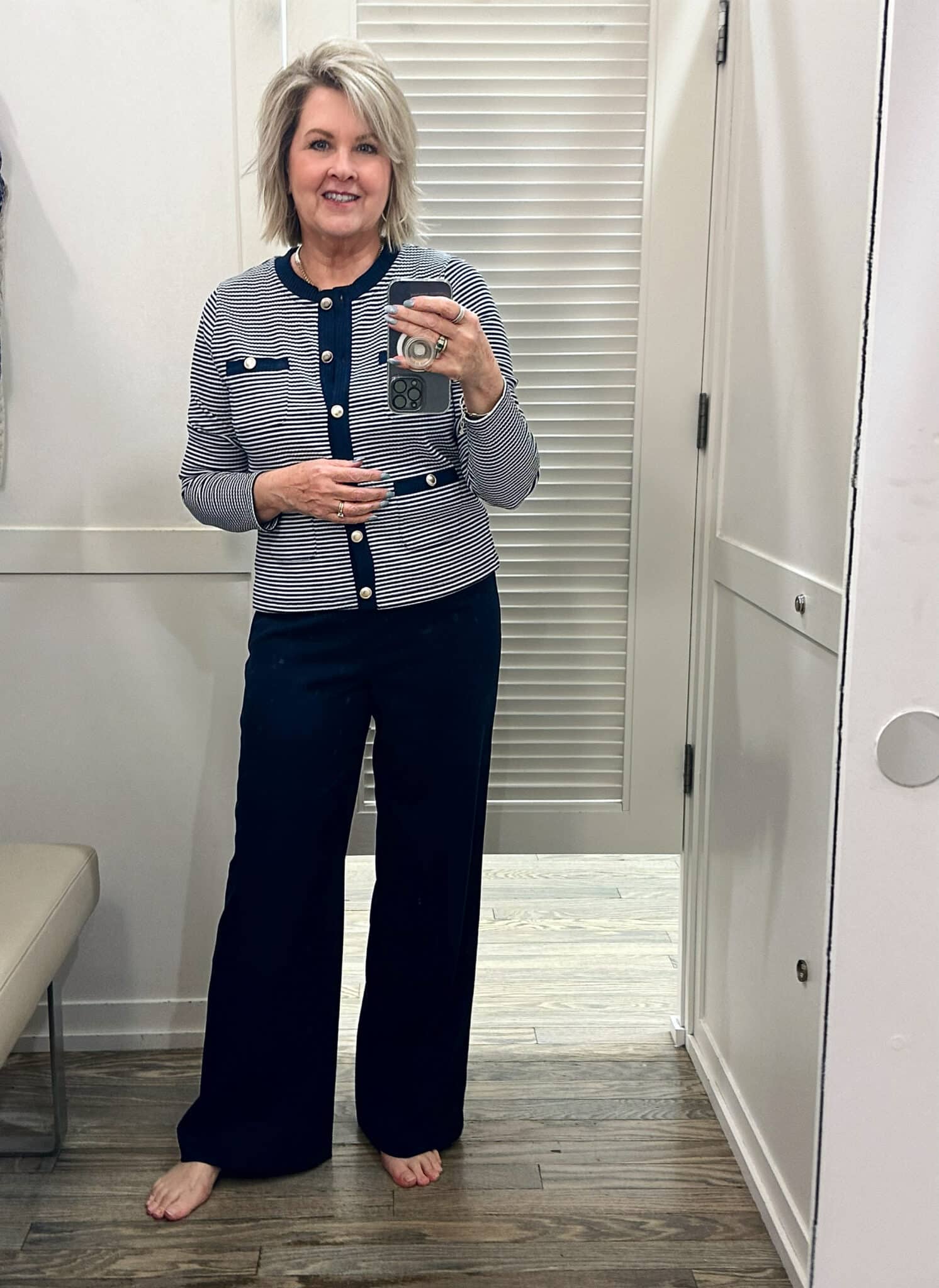 Tania Stephens is wearing a navy & white top and navy pants 
