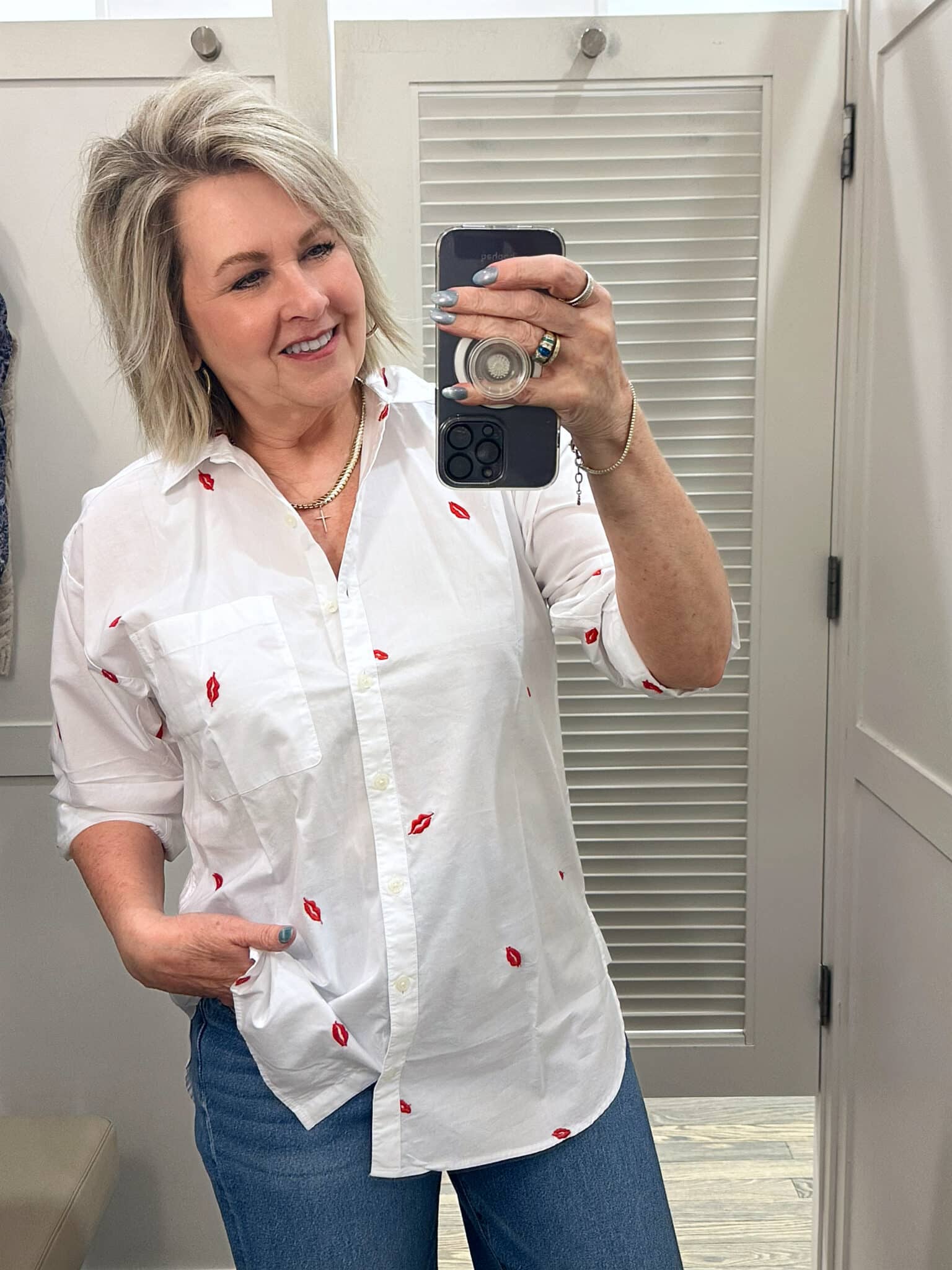 Tania Stephens is wearing a heart button up shirt