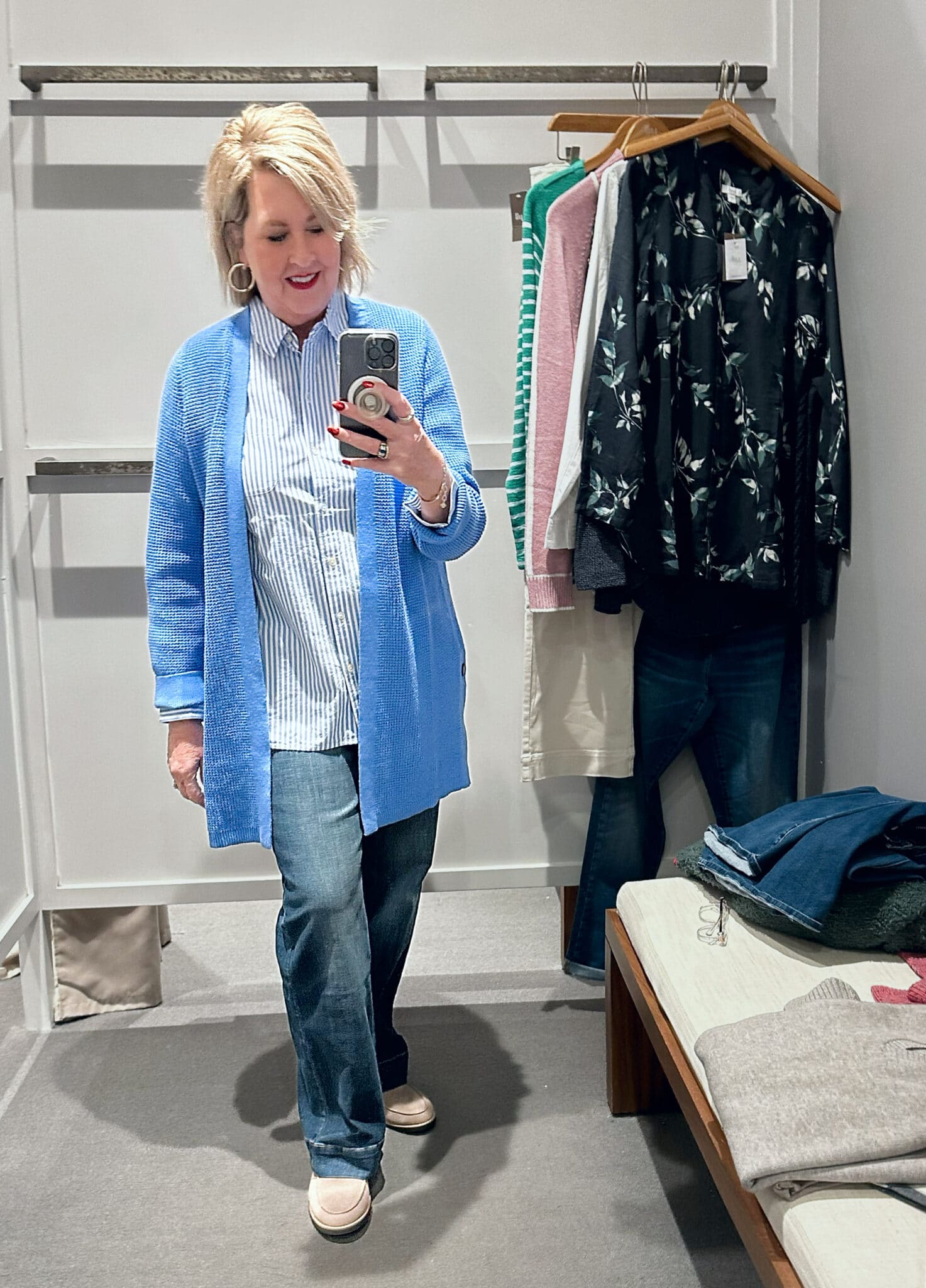 Tania Stephens wearing a striped shirt, a blue cardigan, and trouser jeans from J.Jill