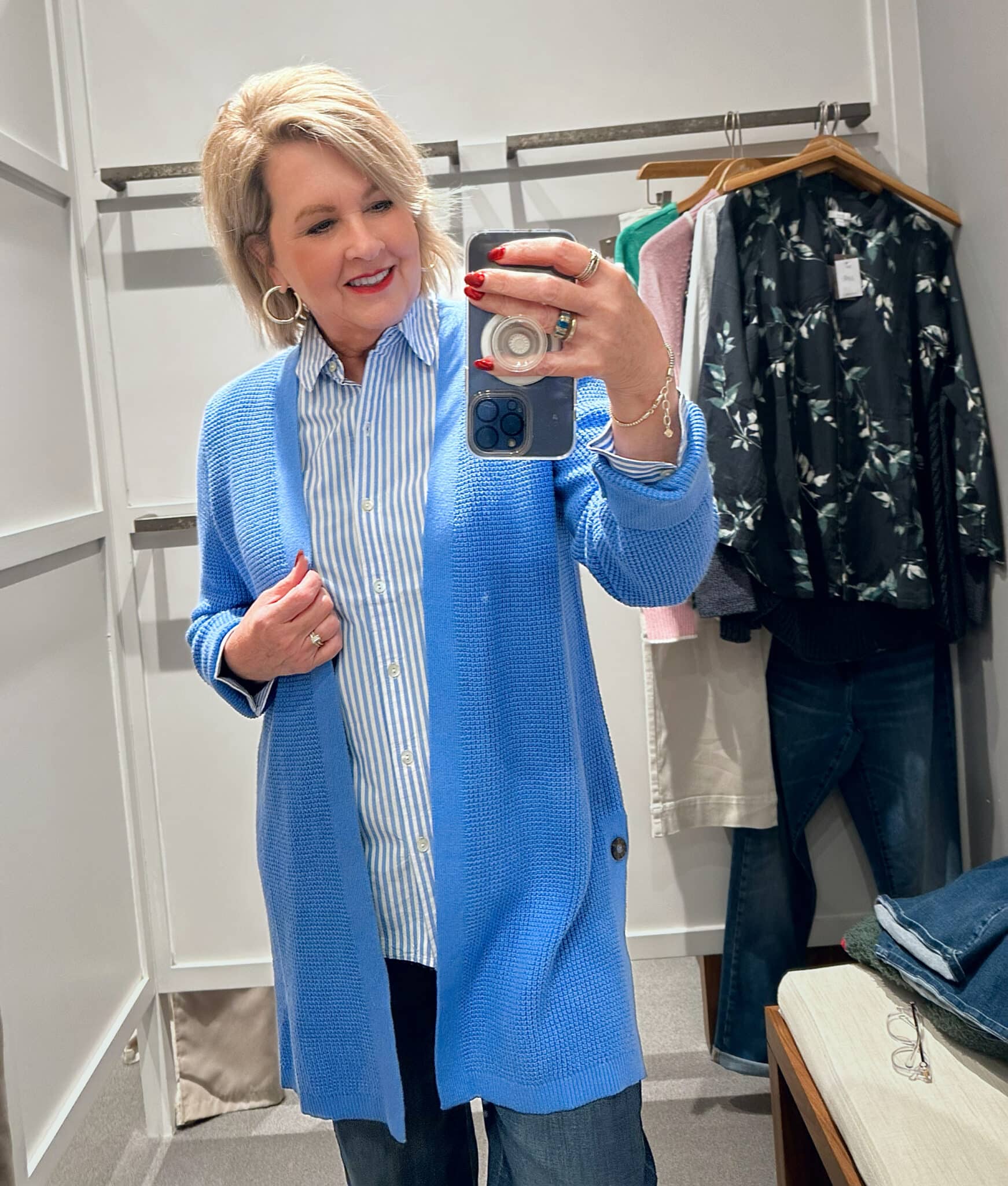 Tania Stephens wearing a striped shirt and a blue cardigan