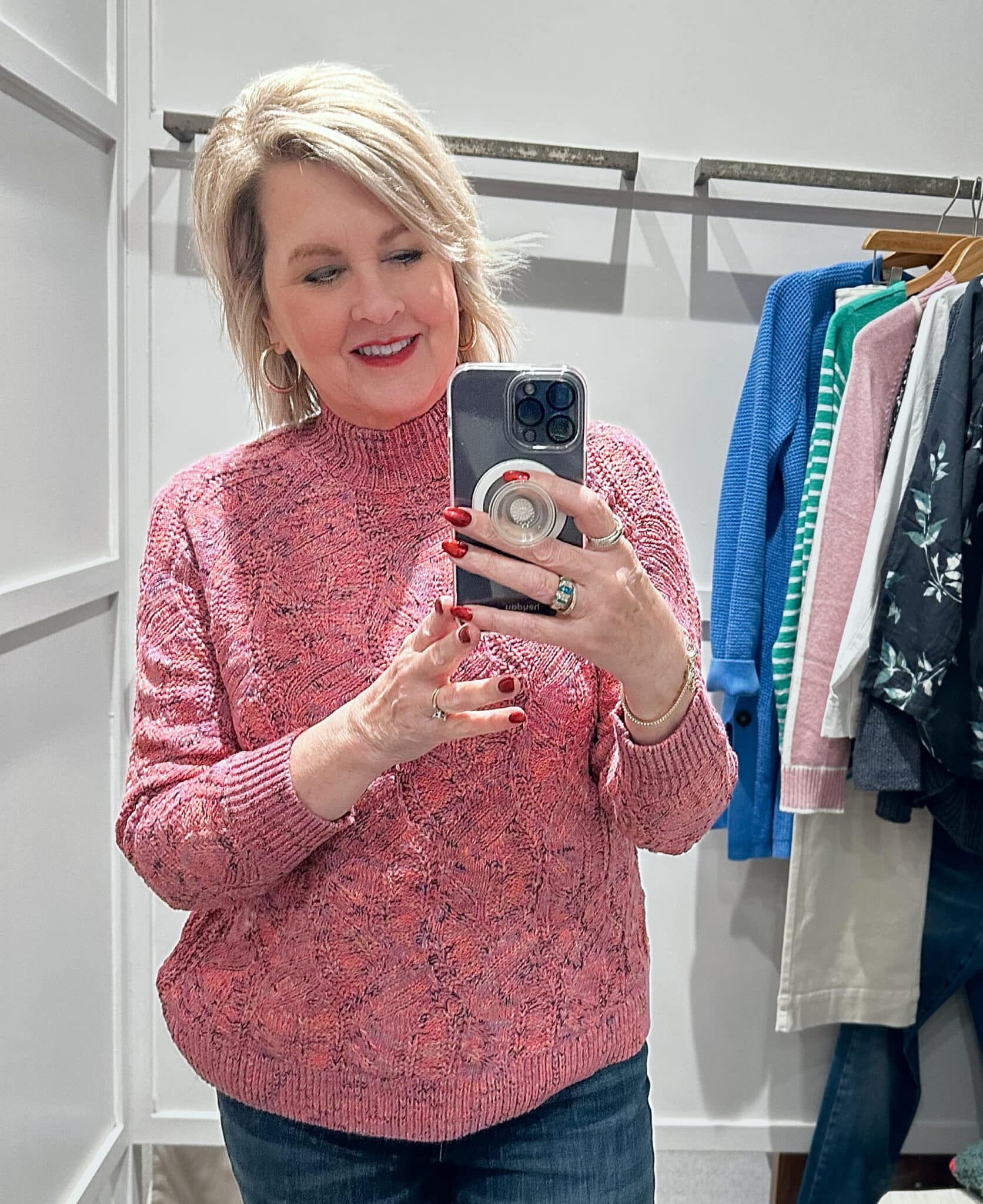Tania Stephens wearing a pink sweater