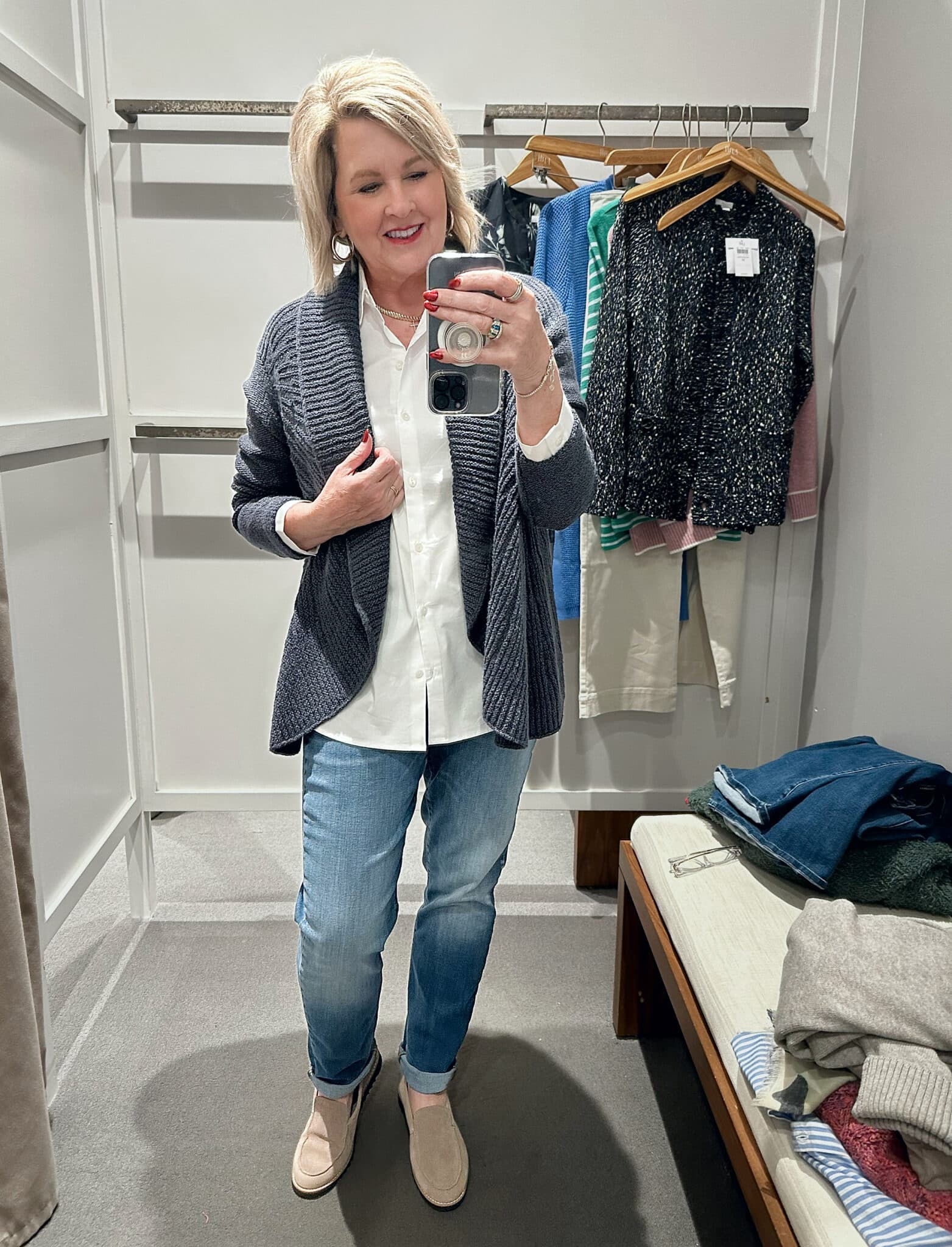 Tania Stephens wearing a white button down shirt, a blue cardigan, and jeans from J.Jill