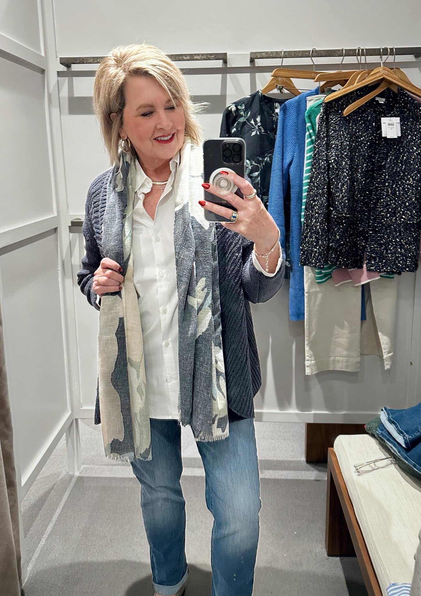 Tania Stephens wearing a white button down shirt, a scarf, and a blue cardigan from J.Jill