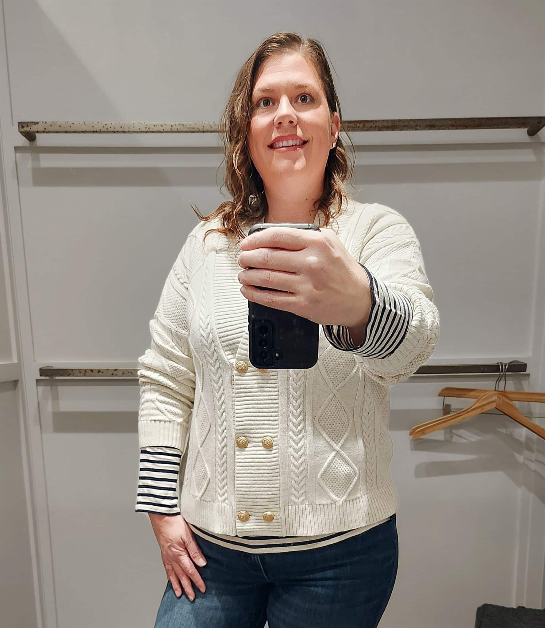 Megan is wearing a striped shirt and a double breasted cardigan from J.Jill