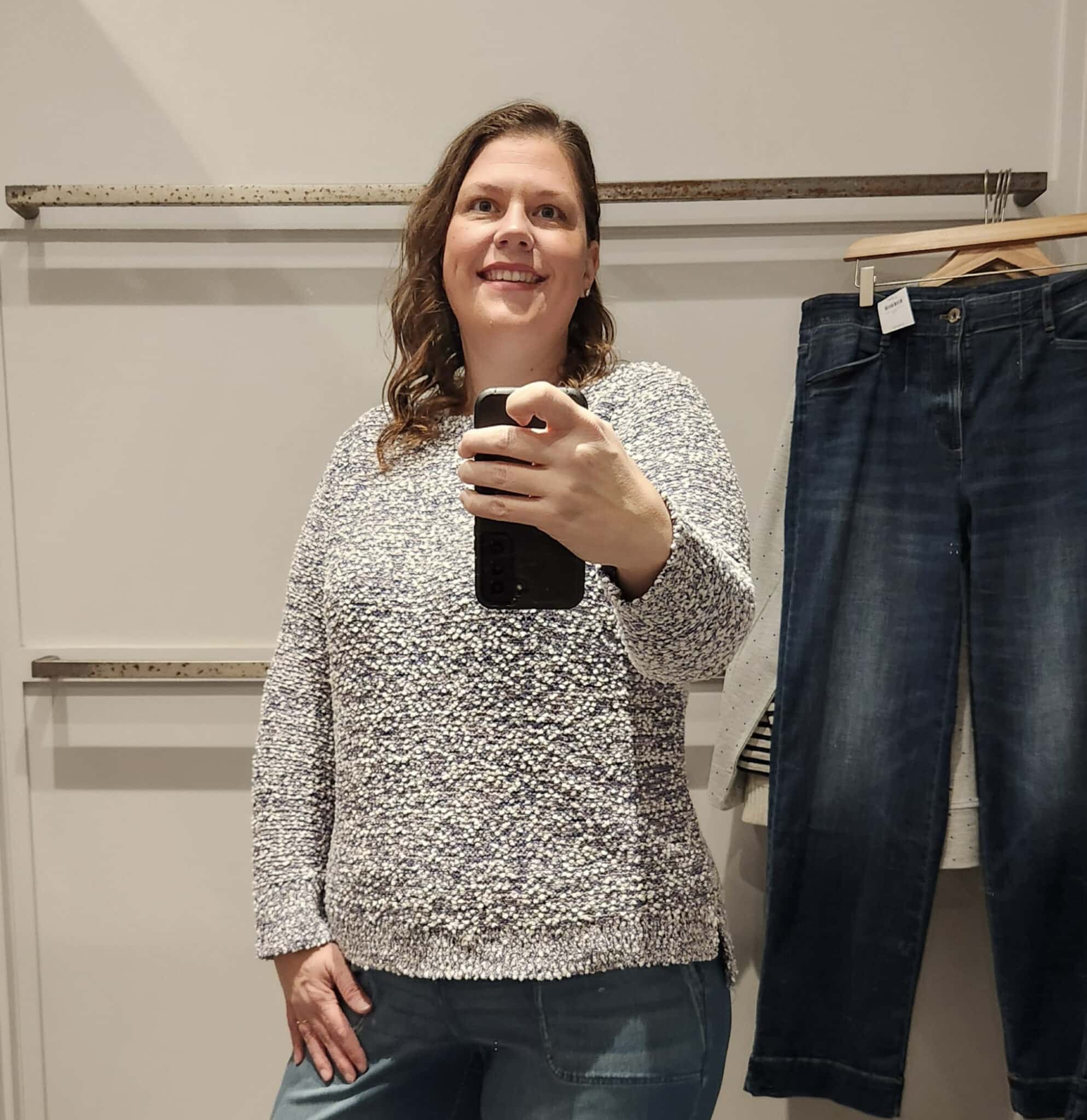 Megan is wearing a gray textured sweater from J.Jill