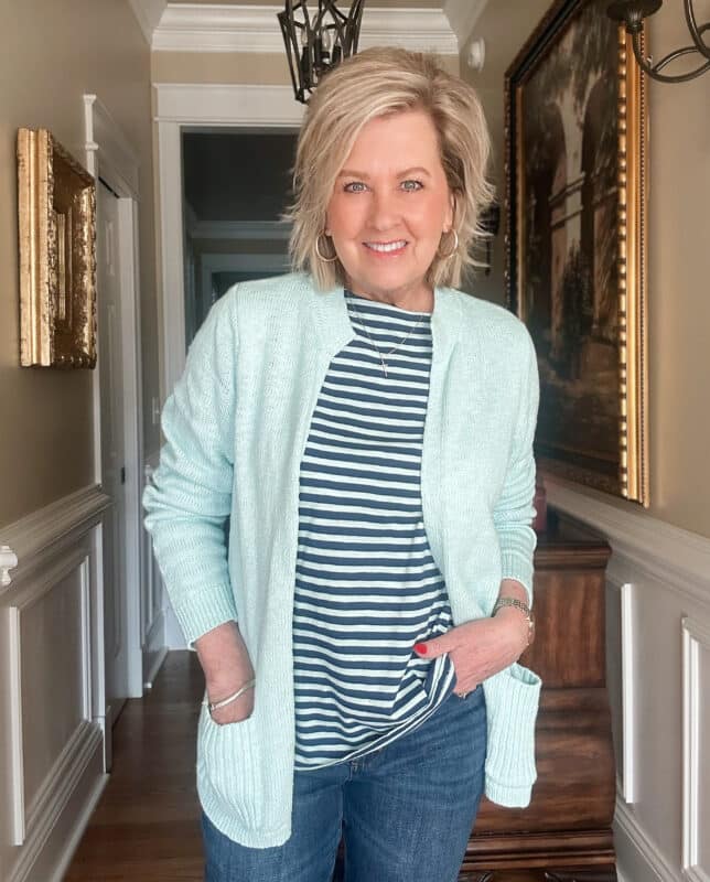 Tania Stephens, over 50 fashion blogger, wearing a Sea Mist cardigan and a striped top from J.Jill for a spring transition look