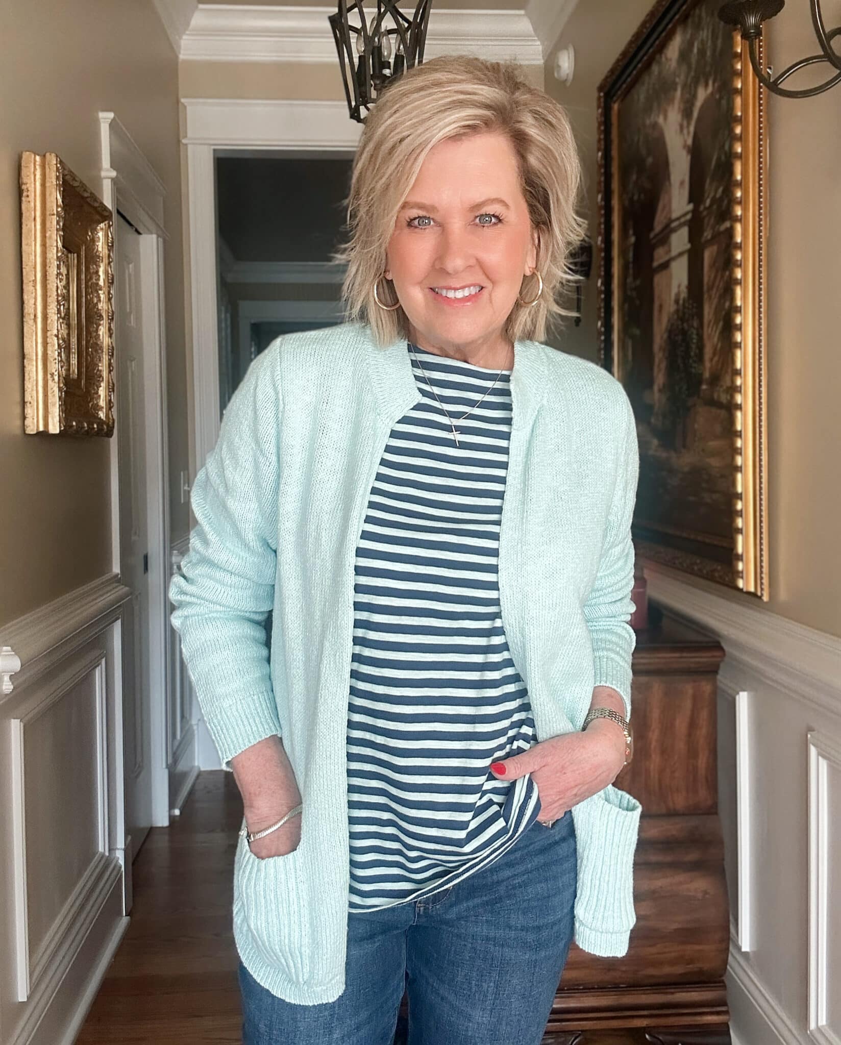 Tania Stephens, over 50 fashion blogger, wearing a Sea Mist cardigan and a striped top from J.Jill for a spring transition look