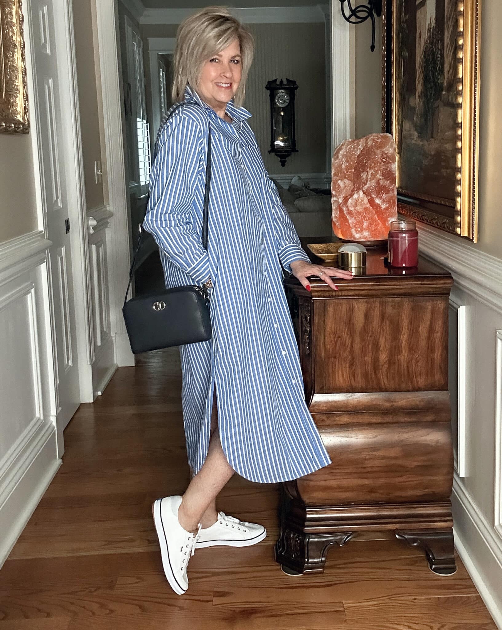 Over 50 Fashion Blogger, Tania Stephens is wearing a a striped blue & white dress with Keds sneakers