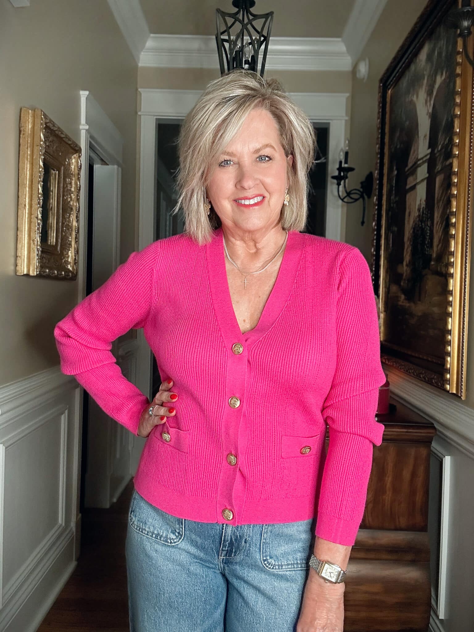 Tania Stephens wearing affordable and budget friendly clothing - a bright pink cardigan from Walmart