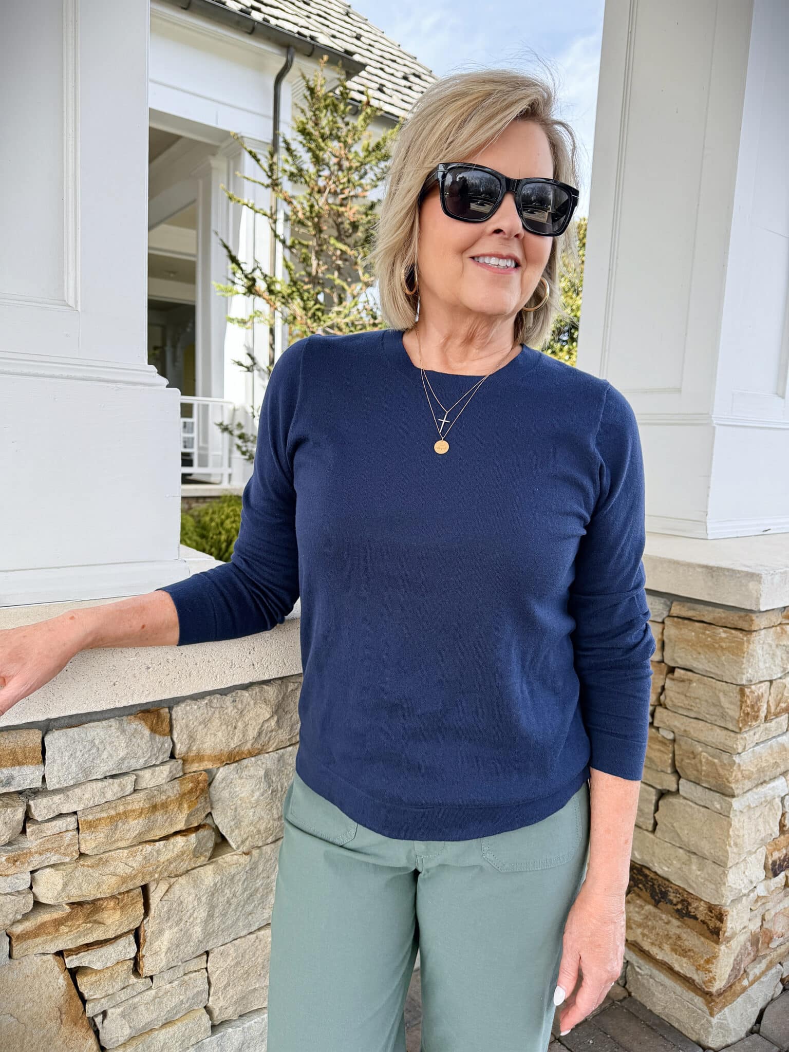 Tania Stephens wearing a navy long sleeve sweater from J.Crew Factory