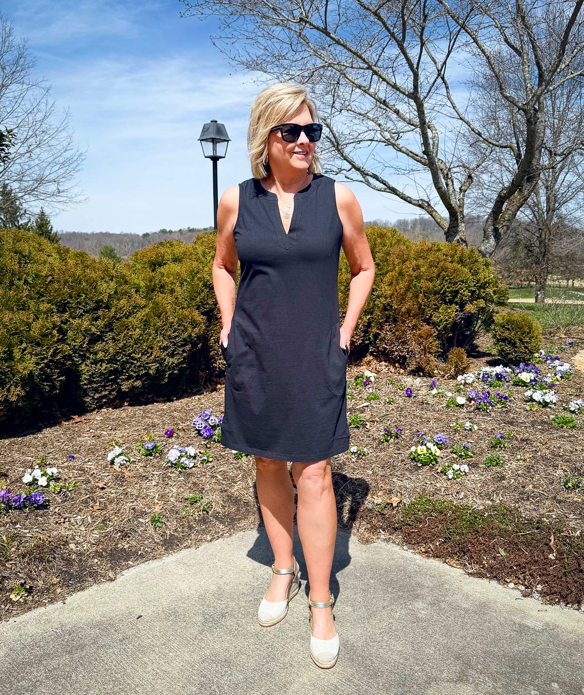 Tania Stephens is wearing a black dress with espadrilles from Lands' End at Nordstrom