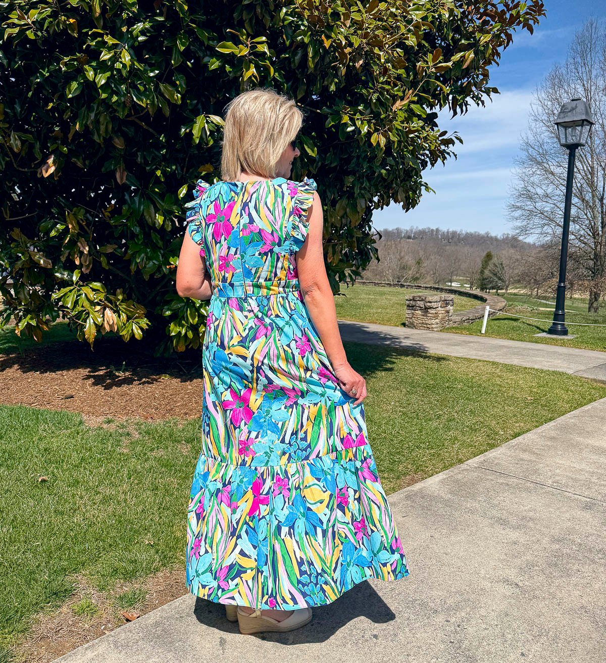 Tania Stephens wearing 2025 Spring styles of a colorful flutter sleeve dress from Nordstrom Rack