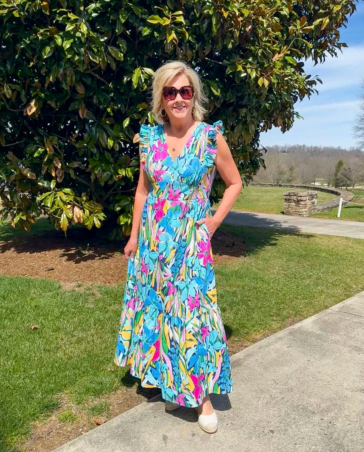 Tania Stephens wearing 2025 Spring styles of a colorful flutter sleeve maxi dress from Nordstrom Rack