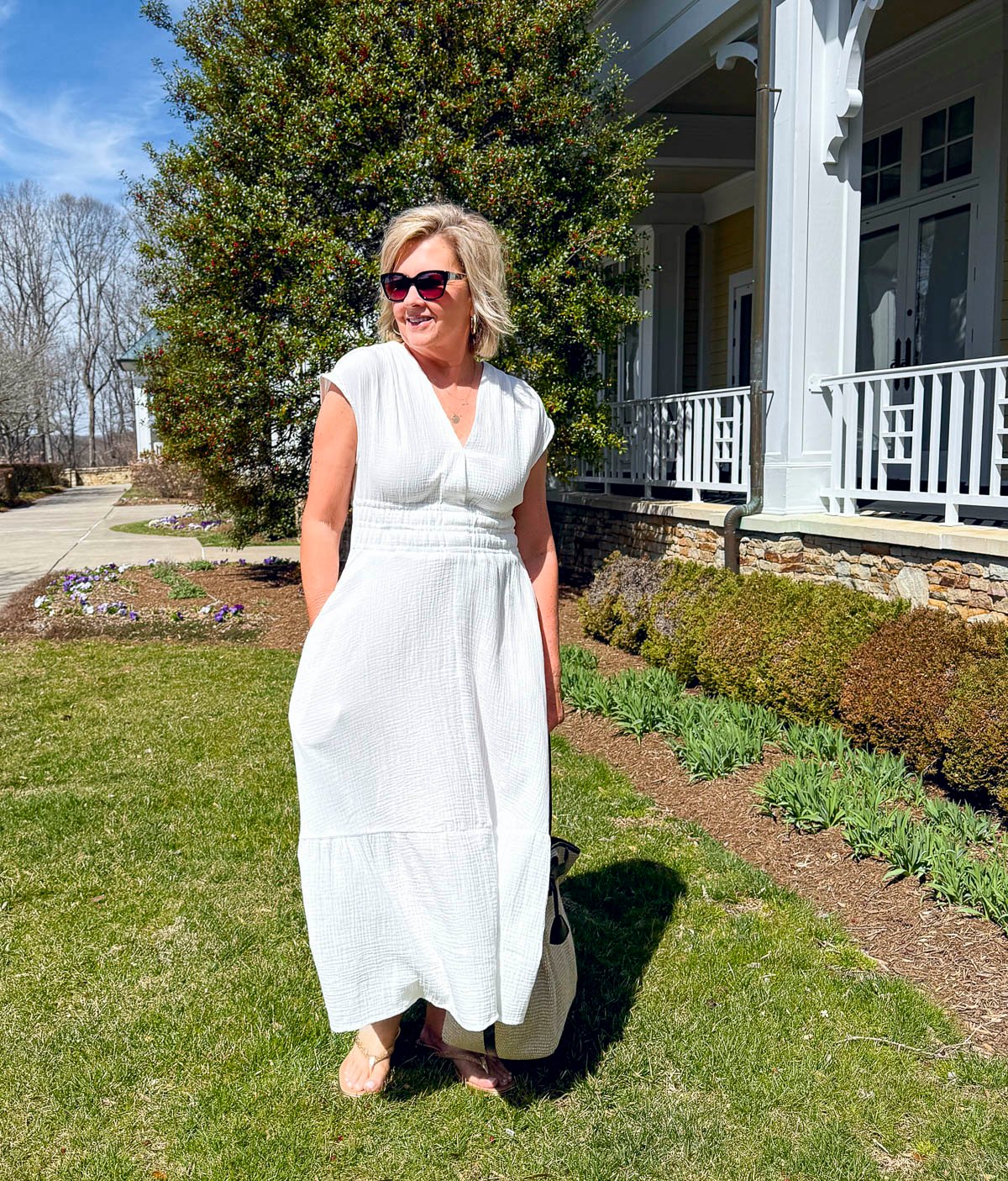 Tania Stephens wearing 2025 Spring styles of a white smocked waist gauze dress from Nordstrom Rack