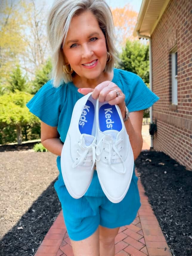 Tania Stephens holding Keds Champion Point Low Leather Lace Up