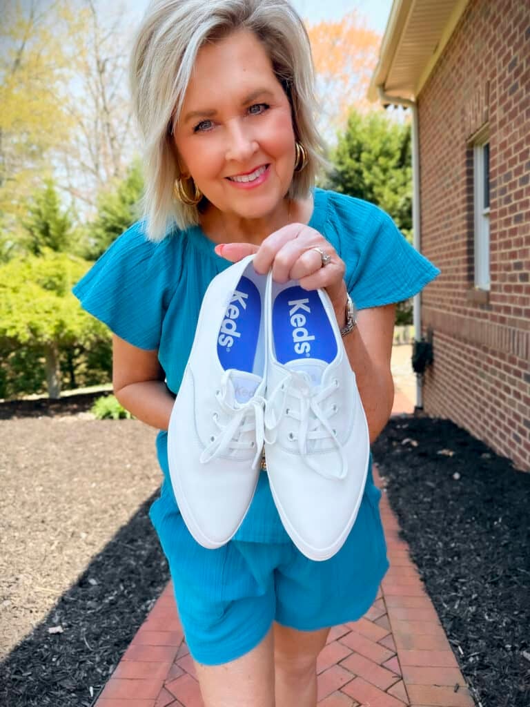 Tania Stephens holding Keds Champion Point Low Leather Lace Up