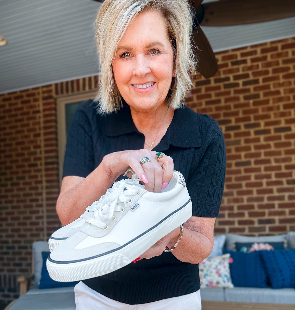 Tania Stephens holding Keds Champion Point Low Leather Lace Up