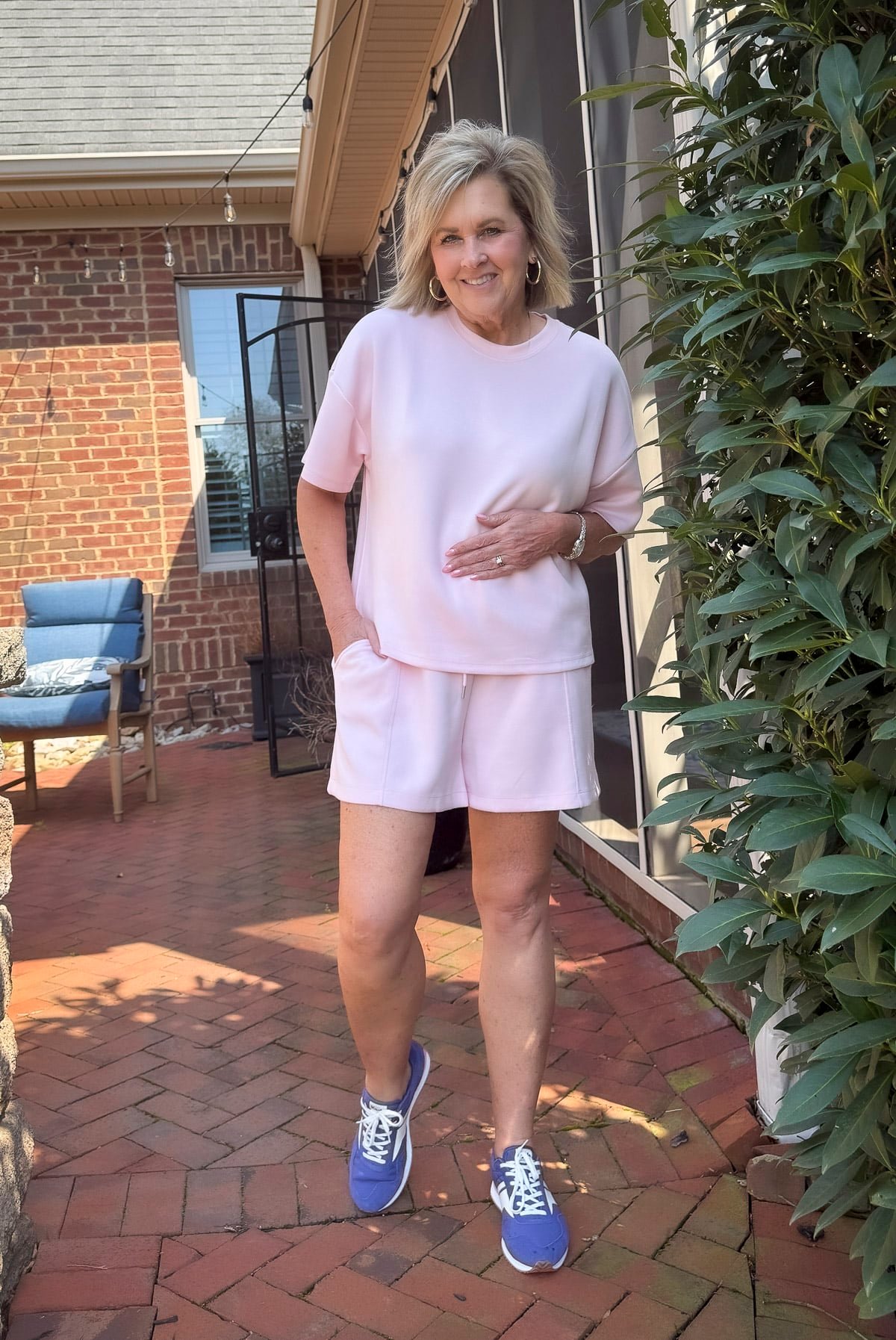woman in a pink shorts outfit wearing Women's Rena Nylon/Suede Lace Up Canvas Sneakers