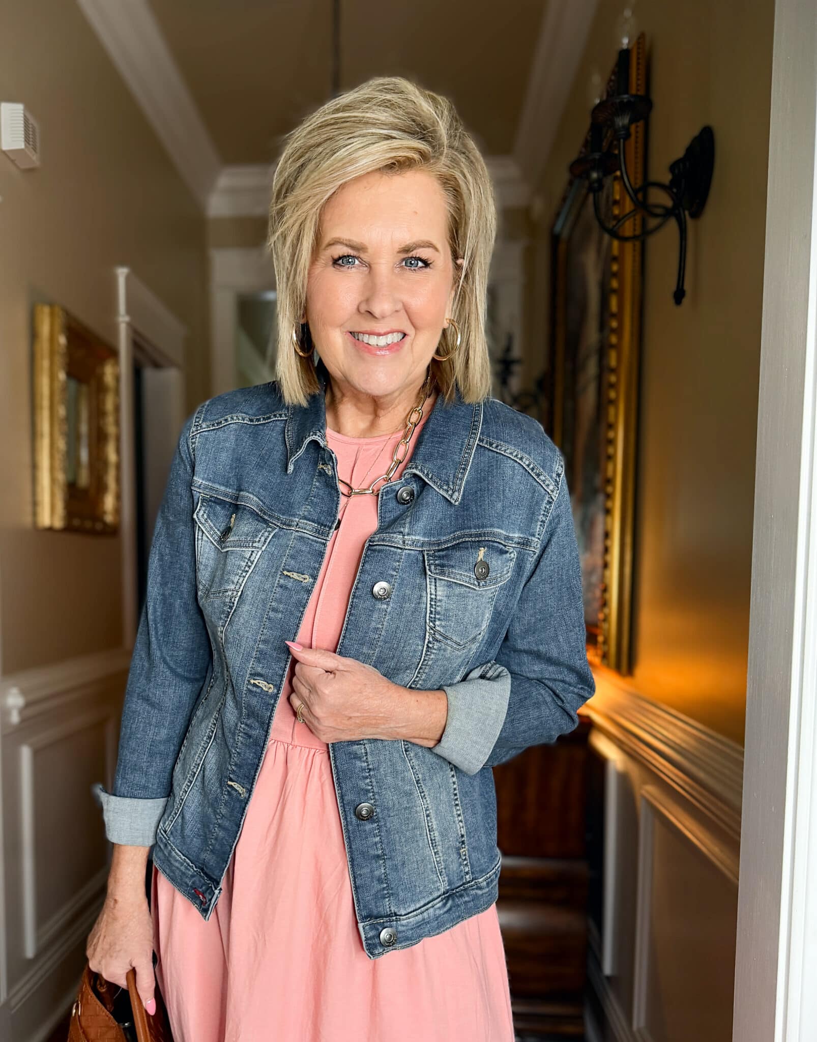 Tania Stephens is wearing a pink dress and a denim jacket from Amazon