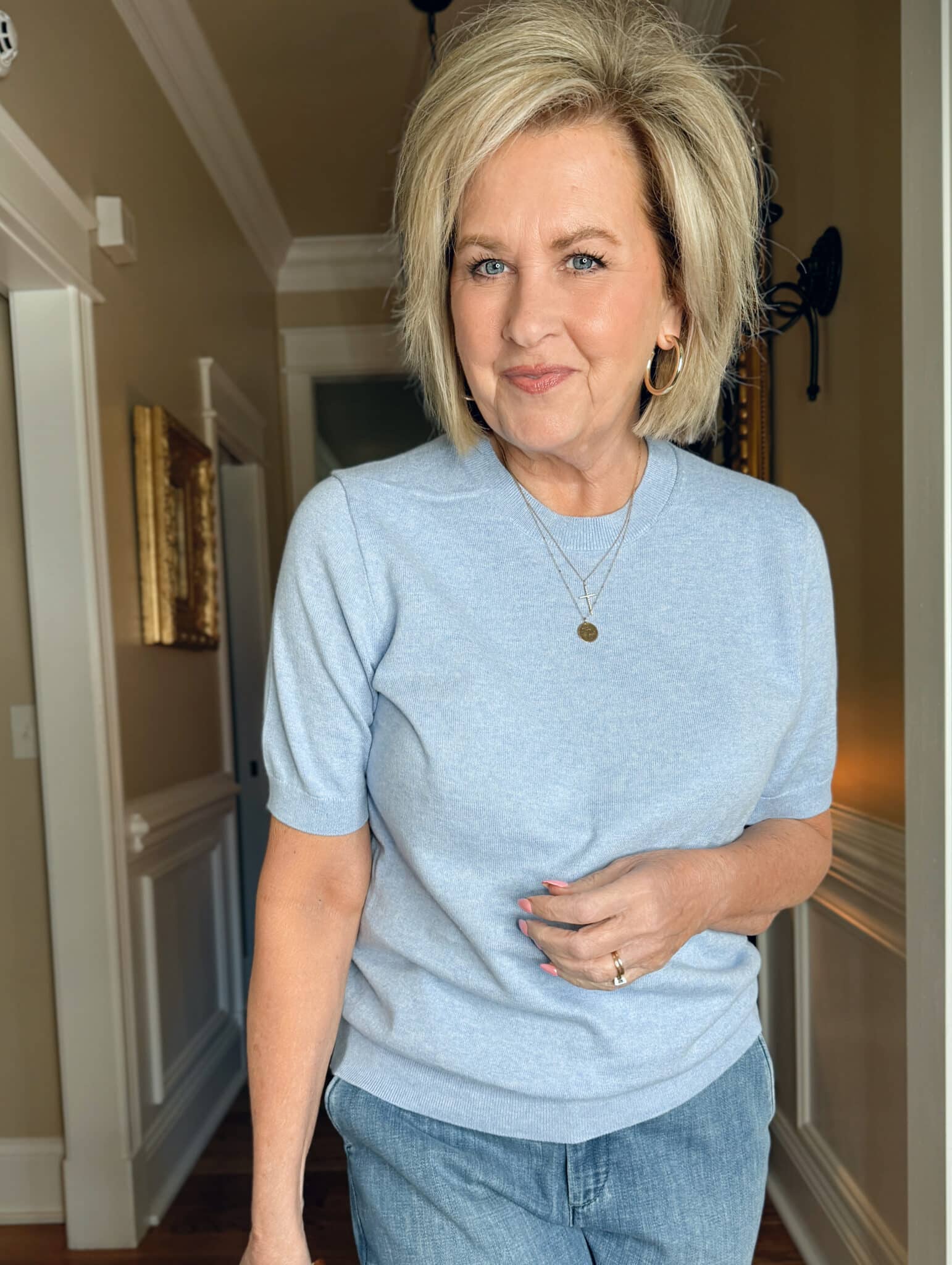 Tania Stephens is wearing a light blue sweater from J.Crew Factory