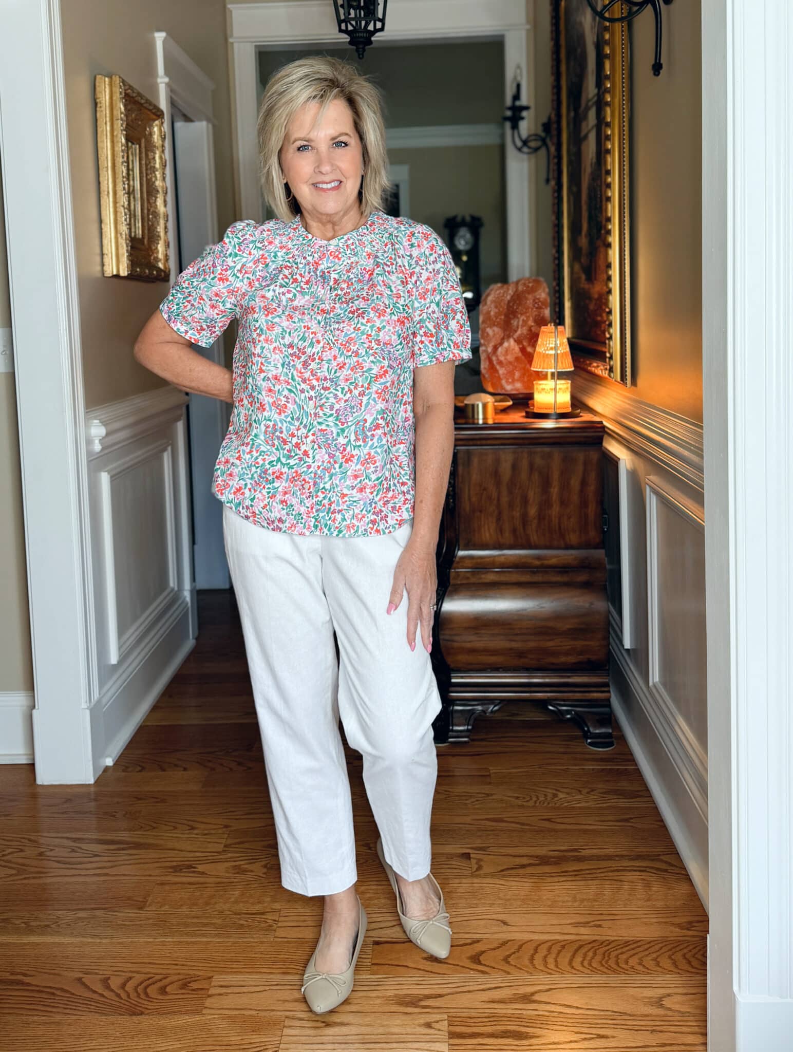 Tania Stephens is wearing a printed puff top and white crops from J.Crew Factory