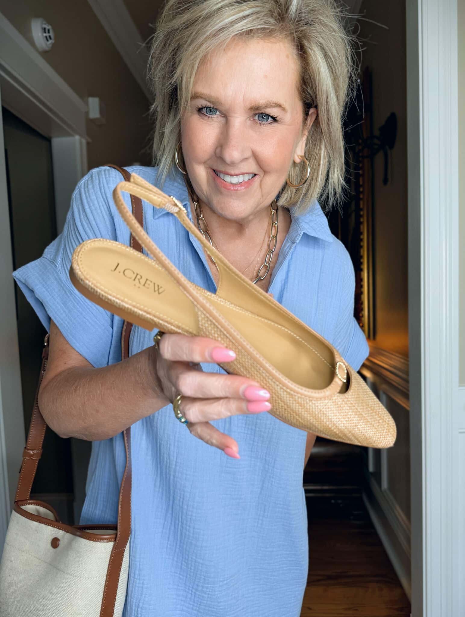 Tania Stephens is wearing a blue gauze dress with flats from J.Crew Factory