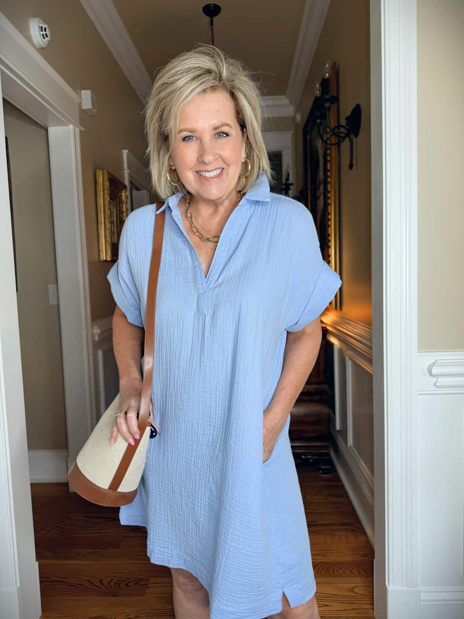 Tania Stephens is wearing a blue dress from J.Crew Factory