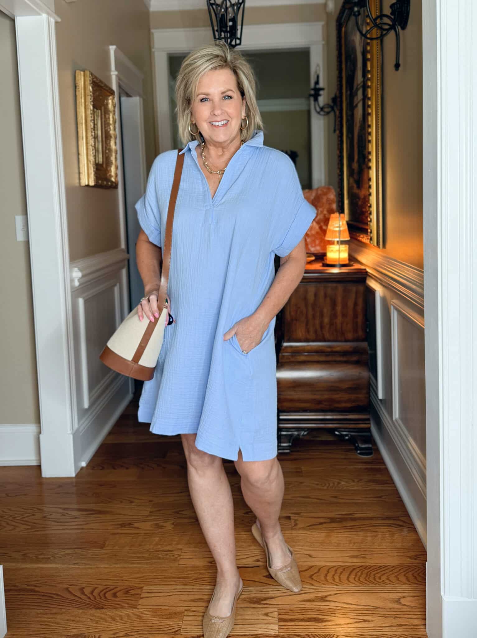 Tania Stephens is wearing a blue gauze dress from J.Crew Factory
