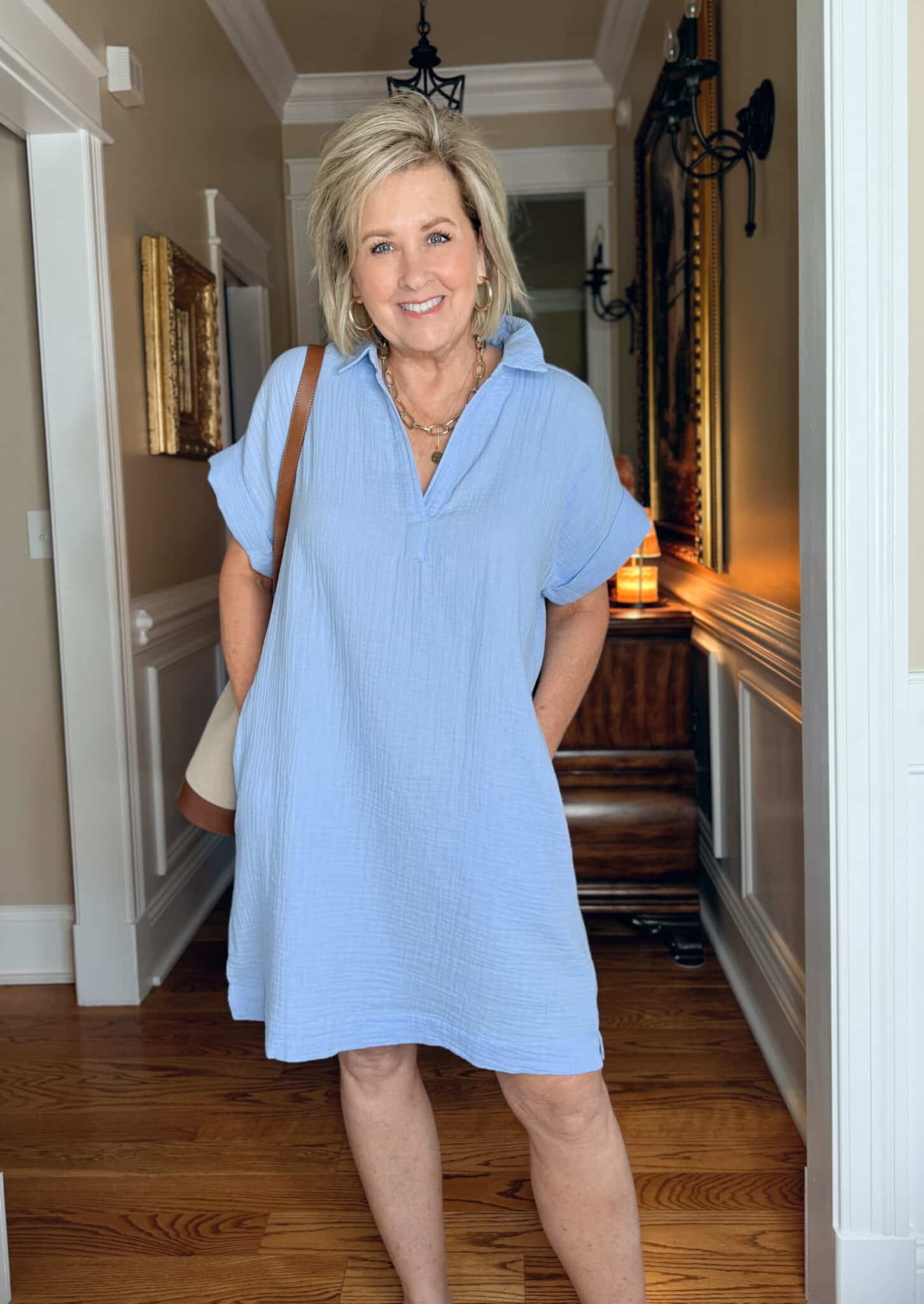 Tania Stephens is wearing a medium blue gauze dress from J.Crew Factory