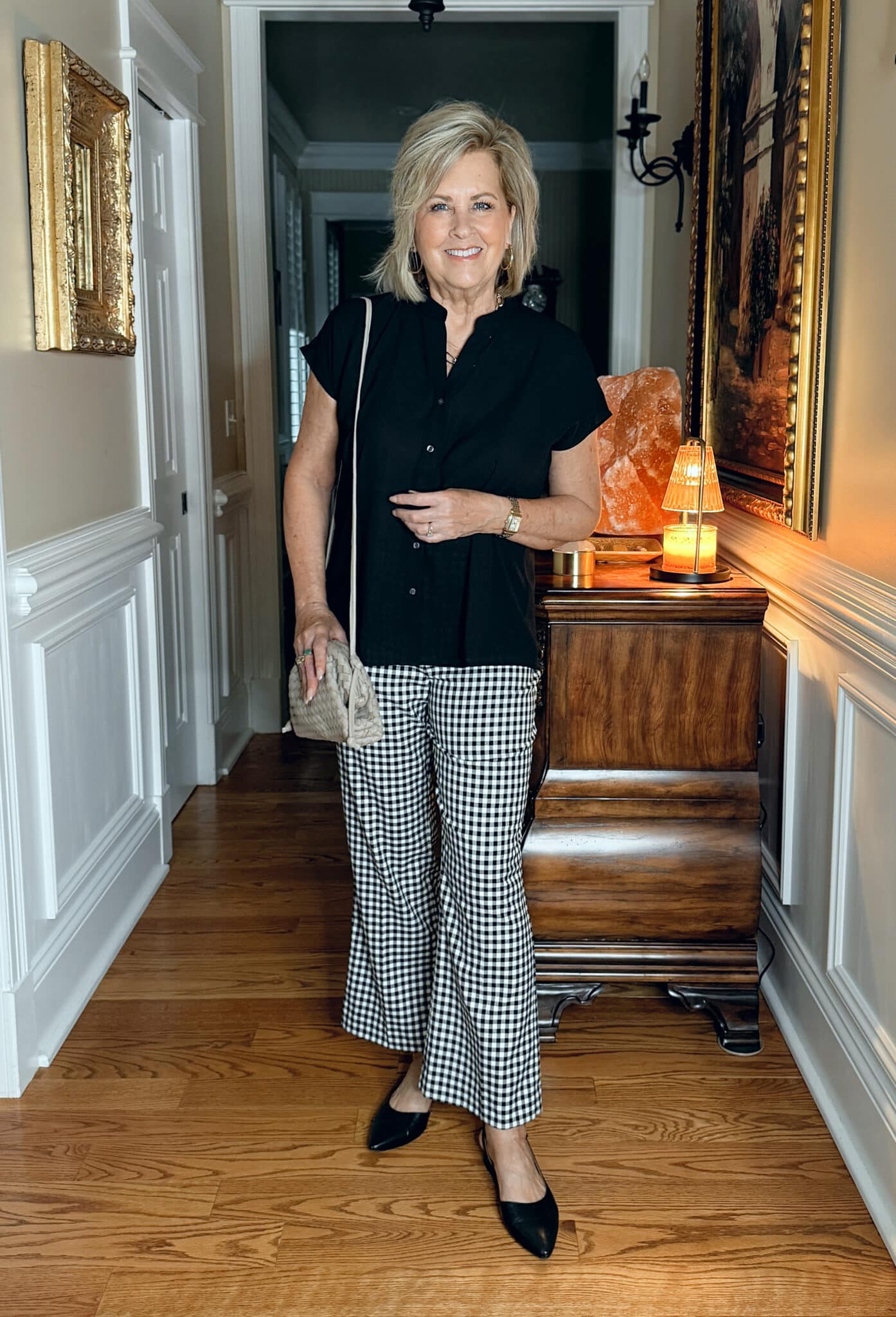 woman wearing Ann Taylor black top and gingham pants for spring