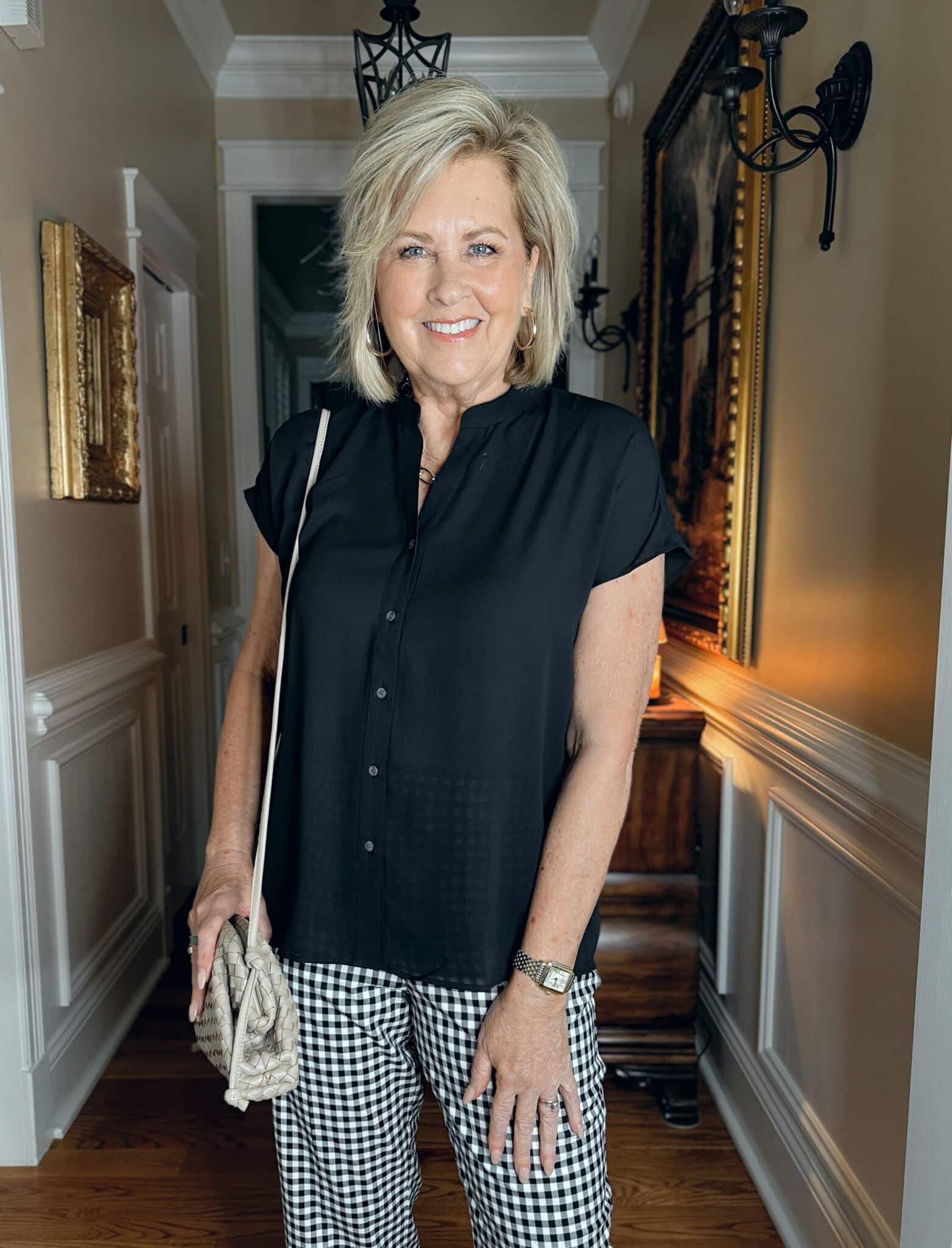 woman wearing Ann Taylor black top for spring