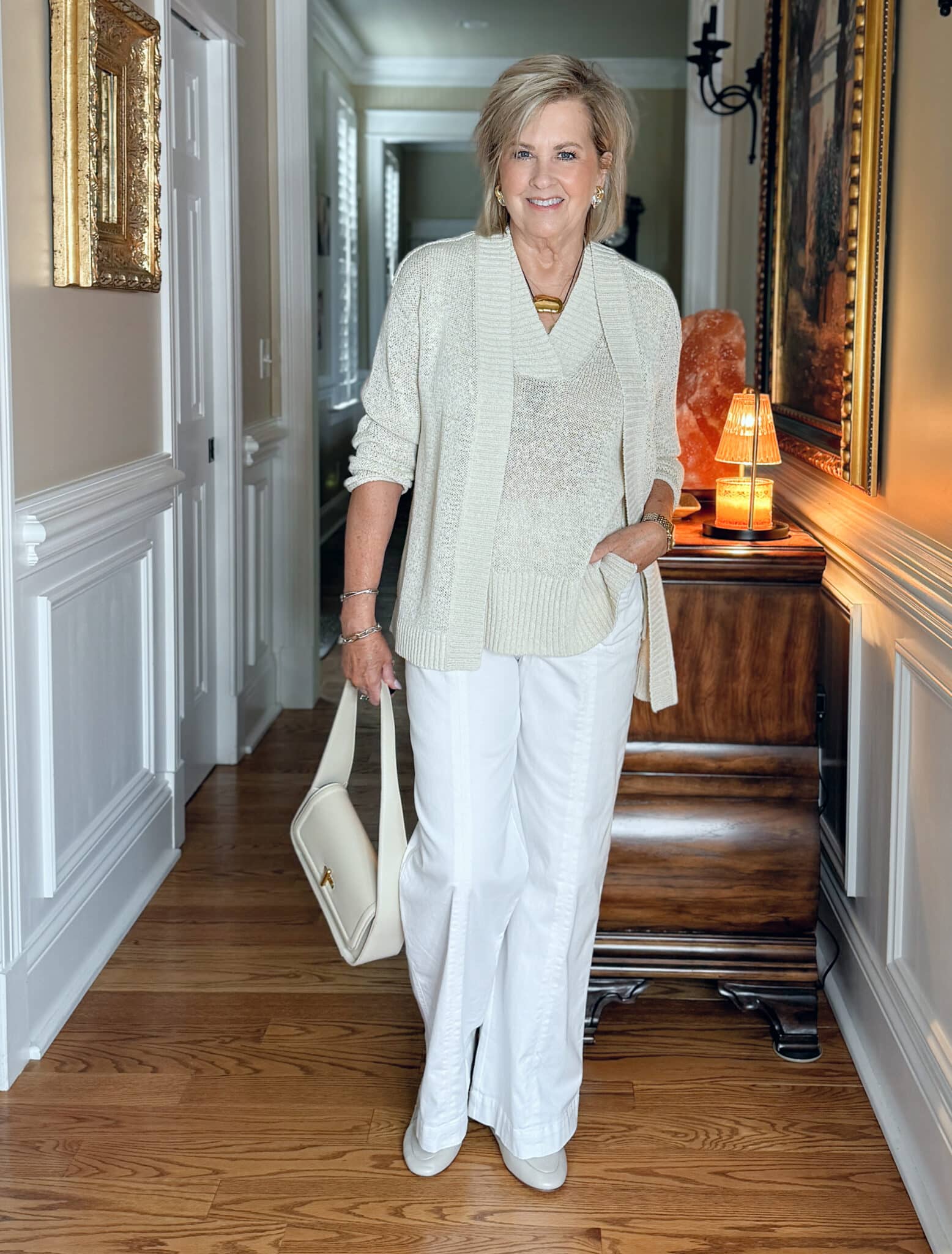 woman wearing a white and beige outfit fitting for a Coastal Grandma