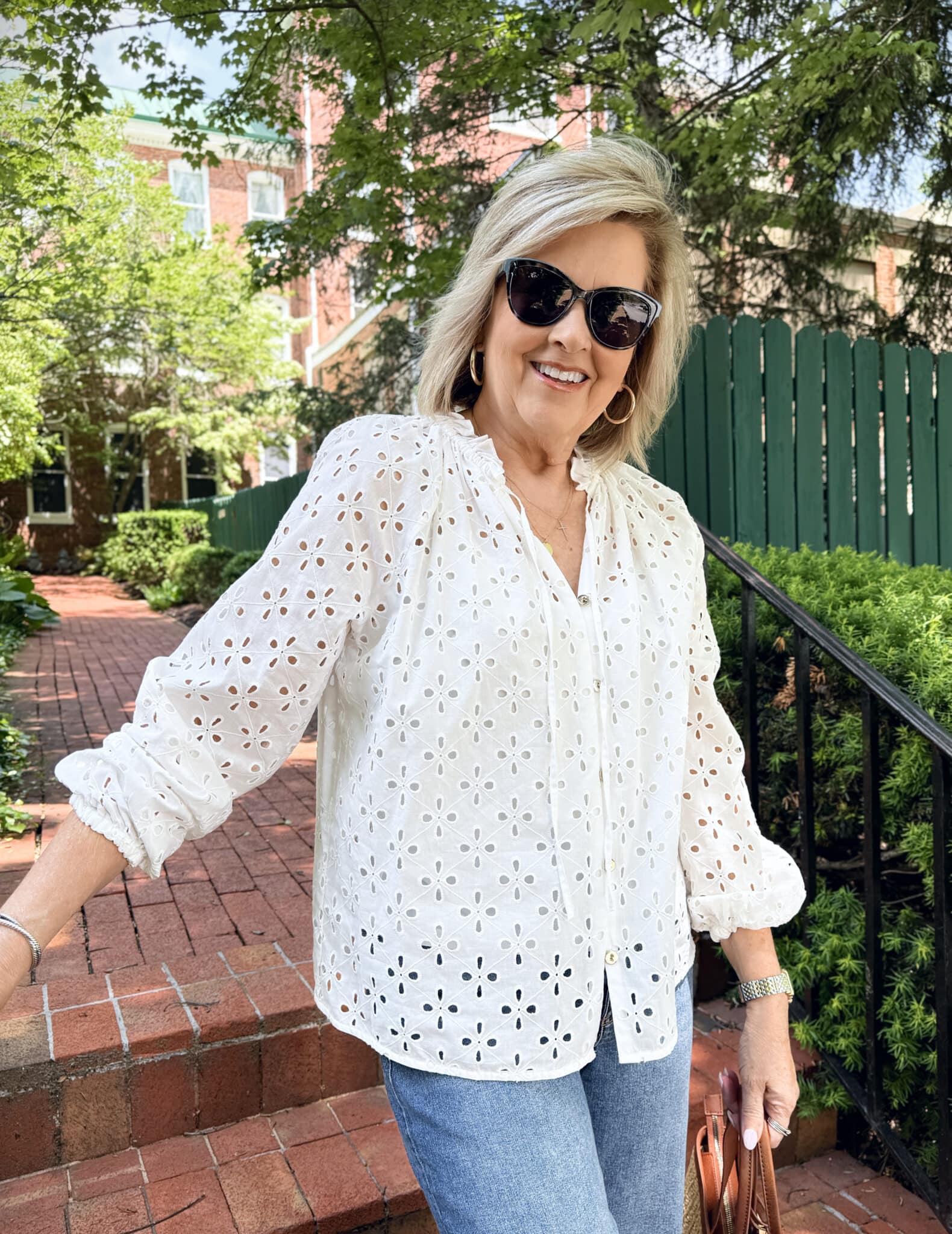 woman wearing a summer outfit from Kohl's - white eyelet shirt