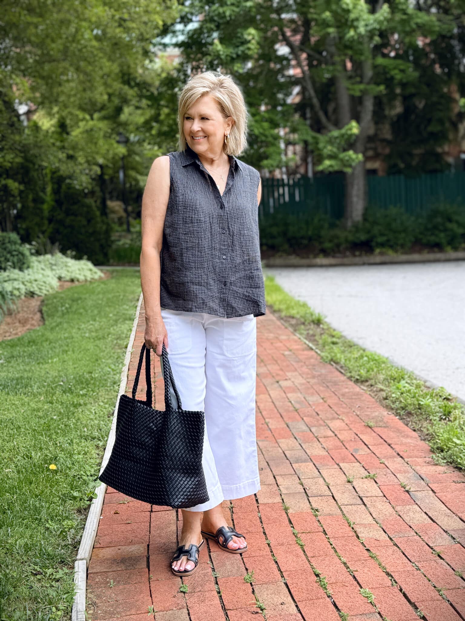 Woman wearing sleeveless checkered shirt and wide-leg ankle crop pants styled for summer from Nordstrom Rack