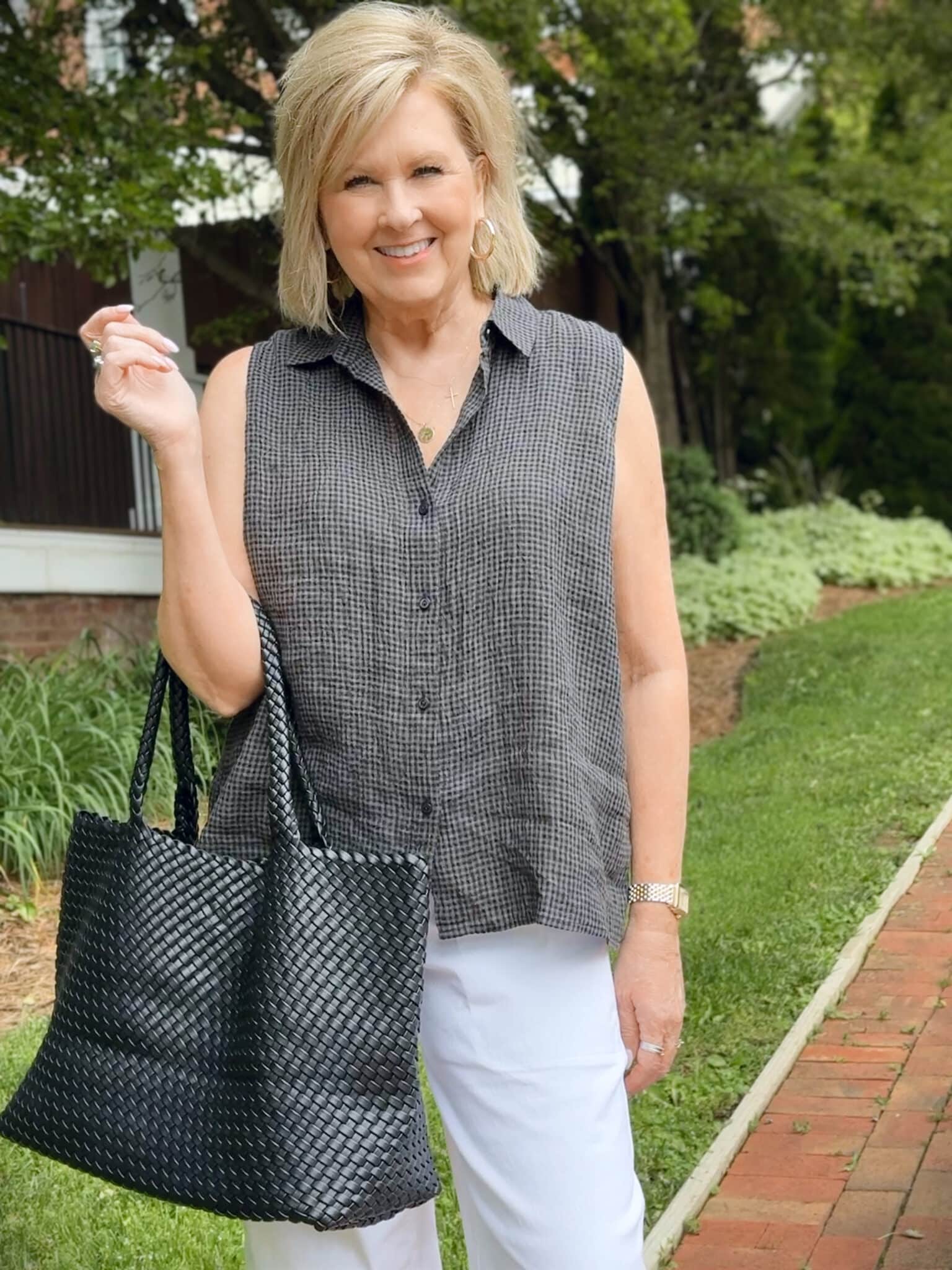 woman wearing a checked sleeveless top